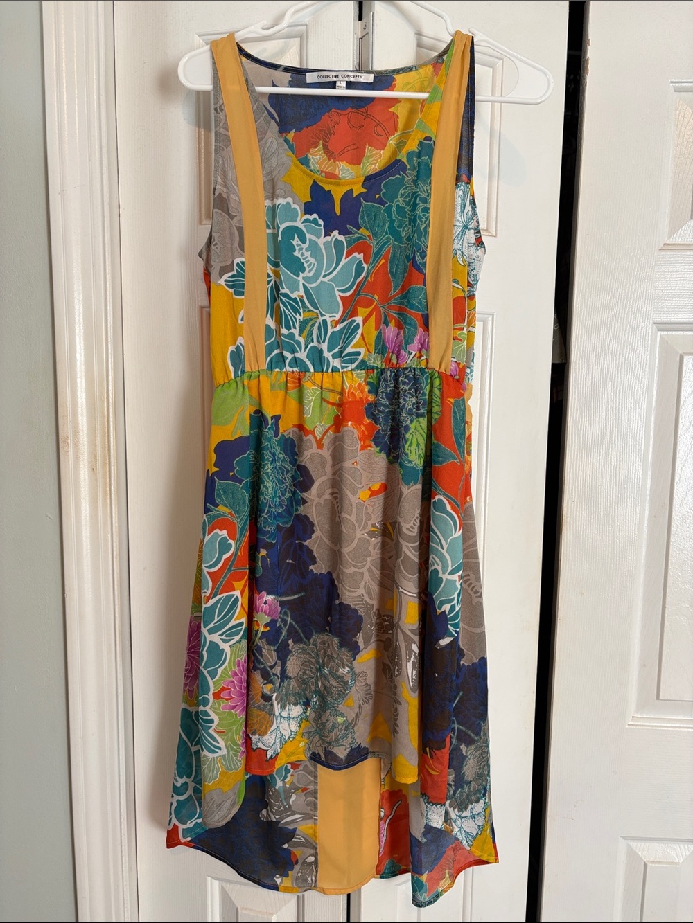 Collective Concepts Multicolor Floral High-Low Mini dress with Gold accents.